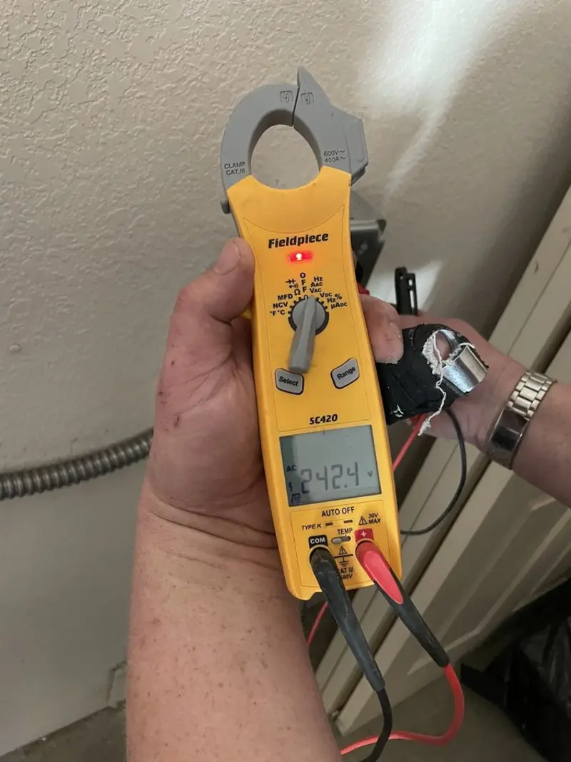 Voltage testing with clamp meter during Electrical Installation Services in Bristol